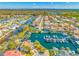 An aerial shot showcases a waterfront community with canals and boat docks at 10627 Hatteras Dr, Tampa, FL 33615