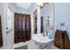 Bathroom with sink, and walk-in shower with decorative curtain at 10627 Hatteras Dr, Tampa, FL 33615