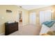 Bedroom with a work desk, bed and an attached bath and closet at 10627 Hatteras Dr, Tampa, FL 33615