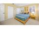 The bedroom has a large window, soft lighting, and closet space, creating a comfortable atmosphere at 10627 Hatteras Dr, Tampa, FL 33615
