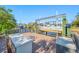 Well-maintained boat dock with boat lift, wooden deck, and canal access for boating enthusiasts at 10627 Hatteras Dr, Tampa, FL 33615