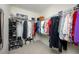 Walk-in closet features extensive shelving, providing ample storage for clothes, shoes, and accessories at 10627 Hatteras Dr, Tampa, FL 33615