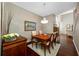 Formal dining room with hardwood floors, a crystal chandelier, and tasteful decor at 10627 Hatteras Dr, Tampa, FL 33615