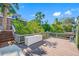 Scenic waterfront dock providing boat access with seating and storage at 10627 Hatteras Dr, Tampa, FL 33615
