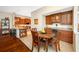Eat-in kitchen includes wooden cabinetry, granite countertops, and updated stainless appliances at 10627 Hatteras Dr, Tampa, FL 33615