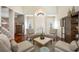 Spacious living room features high ceilings, hardwood floors and neutral decor at 10627 Hatteras Dr, Tampa, FL 33615