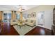 Bright living room with hardwood floors and comfortable seating at 10627 Hatteras Dr, Tampa, FL 33615