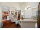 Open-concept living room boasts hardwood floors, high ceilings, and an abundance of natural light at 10627 Hatteras Dr, Tampa, FL 33615