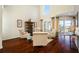 Bright living room with hardwood floors offers comfortable seating with access to a screened lanai at 10627 Hatteras Dr, Tampa, FL 33615