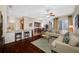 Bright living room with hardwood floors, comfortable seating, and open floor plan at 10627 Hatteras Dr, Tampa, FL 33615