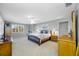 Main bedroom suite with carpet flooring and natural lighting at 10627 Hatteras Dr, Tampa, FL 33615