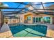 Beautiful pool with a screened enclosure, creating a luxurious backyard oasis at 10627 Hatteras Dr, Tampa, FL 33615