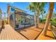 Backyard screened-in pool and wood deck enhance outdoor living at 10627 Hatteras Dr, Tampa, FL 33615