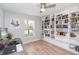Bedroom with a bookcase and neutral walls and light flooring at 10906 Kensington Park Ave, Riverview, FL 33578