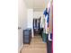 Walk-in closet with efficient shelving and storage, offering organized space for clothing and accessories at 10906 Kensington Park Ave, Riverview, FL 33578