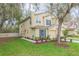 Charming two-story townhome with a well-manicured lawn and attached one-car garage at 10906 Kensington Park Ave, Riverview, FL 33578