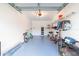 Garage features bikes, racks, storage containers and room for parking at 10906 Kensington Park Ave, Riverview, FL 33578