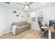 Bright office with a ceiling fan, a window with blinds, and light walls at 10906 Kensington Park Ave, Riverview, FL 33578