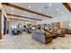 Spacious clubhouse featuring multiple seating areas, travertine floors, and ample lighting at 11257 Egeria Dr, Odessa, FL 33556