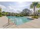 Sparkling community pool with inviting lounge areas and views of beautifully landscaped surroundings at 11257 Egeria Dr, Odessa, FL 33556