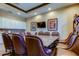 Conference room features a granite table with leather chairs, recessed lighting, and a TV at 11257 Egeria Dr, Odessa, FL 33556