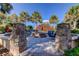 Stone fire pit surrounded by comfortable blue seating within a paved area for relaxing evenings outdoors at 11257 Egeria Dr, Odessa, FL 33556