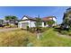 Beautiful home with lush landscaping, mature palm trees and a brick paver driveway at 11257 Egeria Dr, Odessa, FL 33556