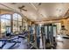Well-equipped gym featuring modern exercise machines, ceiling fans, and bright natural light at 11257 Egeria Dr, Odessa, FL 33556