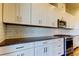 This kitchen features stainless steel appliances, granite counters, and white cabinets at 11257 Egeria Dr, Odessa, FL 33556