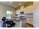 Bright kitchen featuring granite countertops, stainless steel appliances, and a breakfast bar with seating at 11257 Egeria Dr, Odessa, FL 33556