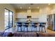 Modern kitchen with an island, breakfast bar seating, stainless steel appliances and granite countertops at 11257 Egeria Dr, Odessa, FL 33556