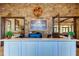 Attractive reception area featuring the 'Esplanade' sign, brick wall, and modern counter at 11257 Egeria Dr, Odessa, FL 33556