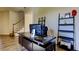 Office desk with monitor, printer, desk and storage with view of staircase at 11257 Egeria Dr, Odessa, FL 33556