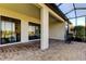 Beautiful screened patio with a seamless transition to the outdoors, ideal for relaxation and entertaining at 11257 Egeria Dr, Odessa, FL 33556