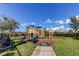 Community playground with slides, climbing equipment, and seating areas at 11257 Egeria Dr, Odessa, FL 33556
