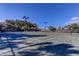 Outdoor tennis courts with lighting and fencing, perfect for evening games and community activities at 11257 Egeria Dr, Odessa, FL 33556