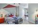 Stylish bedroom with a unique geometric wall design and modern decor at 11347 Crescent Deer Dr, Land O Lakes, FL 34638