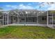 Spacious backyard with a screened in-ground pool and patio at 1166 Lumsden Trace Cir, Valrico, FL 33594