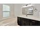 Bathroom with soaking tub, framed mirror, vanity, and sink offers relaxing home experience at 1166 Lumsden Trace Cir, Valrico, FL 33594