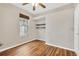Relaxing bedroom with hardwood floors, a ceiling fan, and a built-in closet for organized storage at 1166 Lumsden Trace Cir, Valrico, FL 33594