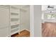 Walk-in closet featuring custom shelving and drawers, perfect for organized storage in the home at 1166 Lumsden Trace Cir, Valrico, FL 33594