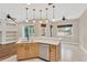 Bright kitchen features stainless steel appliances, counter seating, and tile flooring at 1166 Lumsden Trace Cir, Valrico, FL 33594