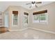 Living room with neutral walls, large windows and light tile floors throughout at 1166 Lumsden Trace Cir, Valrico, FL 33594