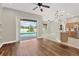 Spacious living room with wood flooring and a view of the screened-in pool at 1166 Lumsden Trace Cir, Valrico, FL 33594