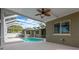 View of the screened in-ground pool, patio, and house at 1166 Lumsden Trace Cir, Valrico, FL 33594