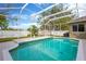 Beautiful in-ground screened pool surrounded by a patio and well-maintained backyard at 1166 Lumsden Trace Cir, Valrico, FL 33594