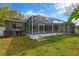 An expansive screened-in pool and patio offer the perfect space for outdoor entertaining and relaxation at 1166 Lumsden Trace Cir, Valrico, FL 33594