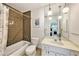 Full bathroom with tiled shower/tub and modern vanity at 139 Bluff View Dr # 105, Belleair Bluffs, FL 33770