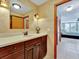 Bright bathroom with a single vanity and view into the bedroom, offering space and functionality at 1400 Gulf Blvd # 204, Clearwater Beach, FL 33767