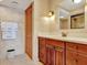 Bathroom with a wood vanity, ample counter space, and tiled walls for a clean aesthetic at 1400 Gulf Blvd # 204, Clearwater Beach, FL 33767